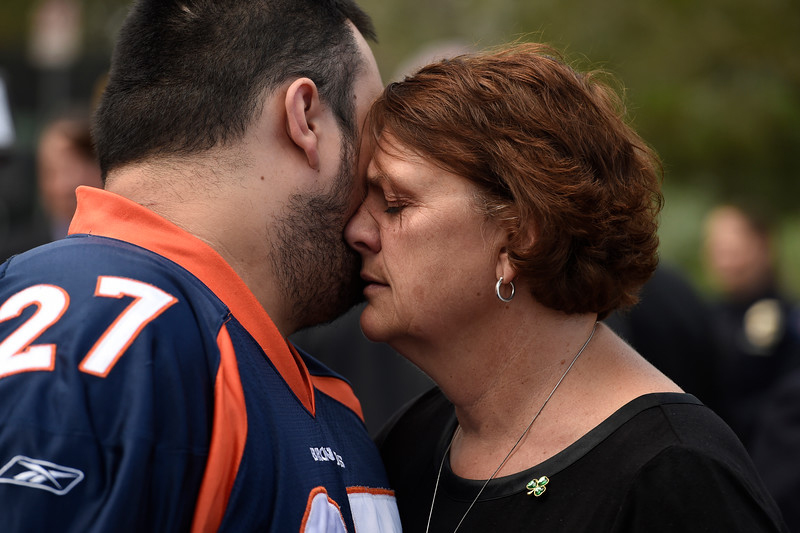 "Terry Sullivan, right, mother of Aurora theater shooting victim Alex Sullivan, hugs Bryan Beard, left, Alex's best friend outside of  the Arapahoe County Justice Center in Centennial, Colorado on  August 7, 2015.  (Photo By Helen H. Richardson/ The Denver Post)"