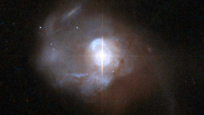 Markarian 231 is a Type-1 Seyfert galaxy that was discovered in 1969 as part of a search of galaxies with strong ultraviolet radiation. There are clear signs that a powerful active galactic nucleus is present in the center of the galaxy. (Wikipedia)