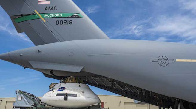 A NASA Orion spacecraft model is loaded into a Boeing C-17 Globemaster III to test the parachute system at the U.S. Army Yuma Proving Ground in Arizona on Wednesday, August 26, 2016. (Radislav Sinyak / NASA)