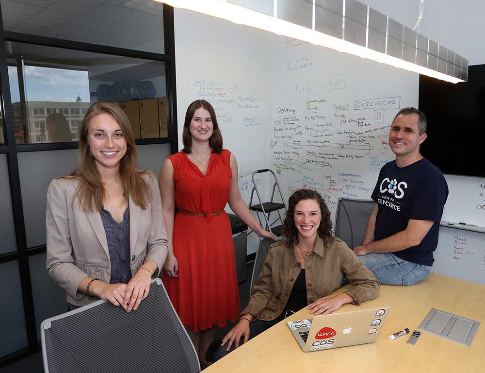 Staff of the the Reproducibility Project at the Center for Open Science in Charlottesville, Va., from left: Mallory Kidwell, Courtney Soderberg, Johanna Cohoon and Brian Nosek. Dr. Nosek and his team led an attempt to replicate the findings of 100 social science studies. Credit Andrew Shurtleff for The New York Times