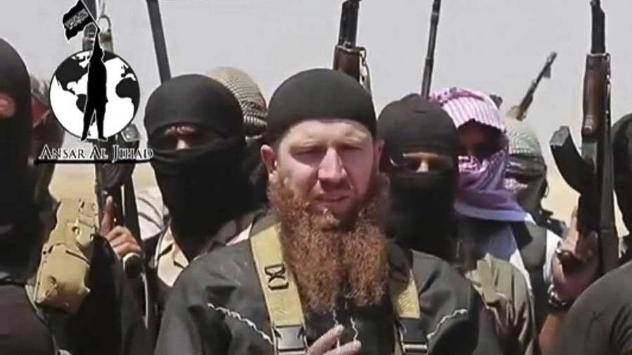 Omar al-Shishani, a Chechen jihadist, among a group of ISIL fighters as they declare the elimination of the border between Iraq and Syria. The screenshot was taken from a video posted on a social media account frequently used for ISIL communications. IMAGE: Militant Social Media Account Via AP VIDEO/ASSOCIATED PRESS