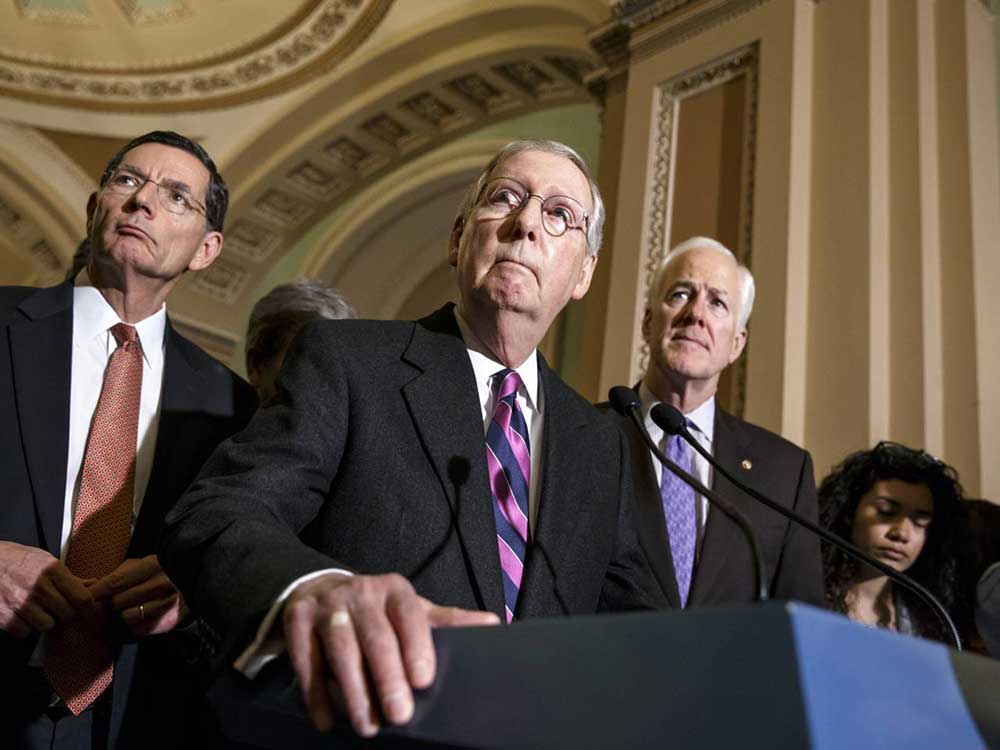 Senate Majority Leader Mitch McConnell of Ky., with Senate Minority Whip John Cornyn of Texas, right, and Sen. John Barrasso, R-Wyo., left (AP Photo/J. Scott Applewhite)