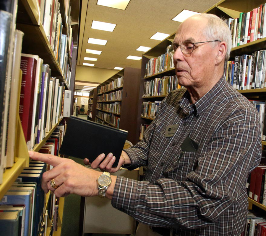Elderly adult in a library