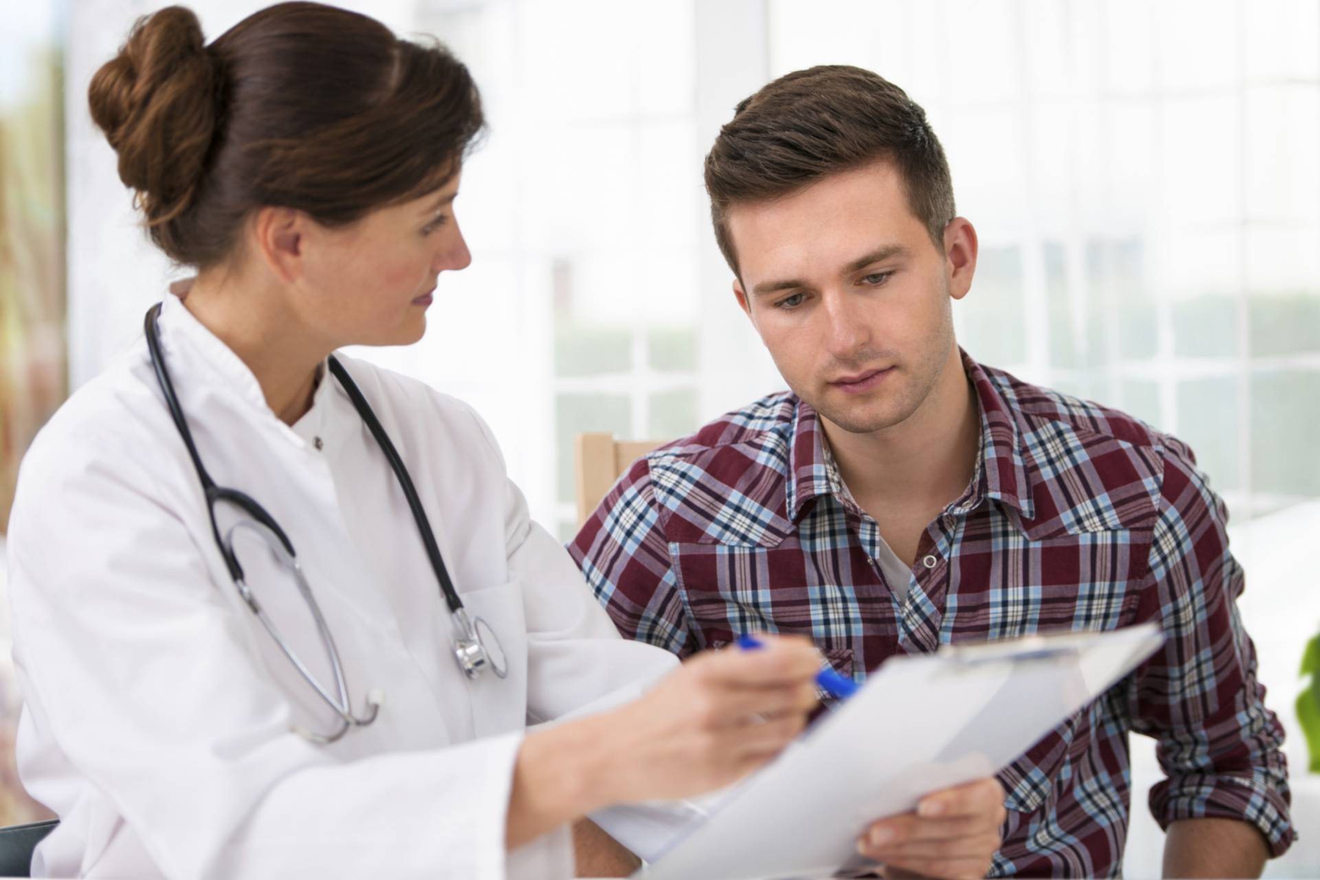 Doctor with male young patient