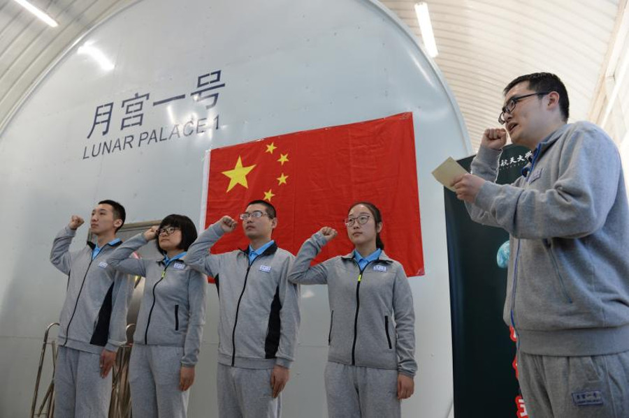 The four volunteer students prepare for living in the Yuegong-1 or “Lunar Palace.” Image Credit: STR/AFP/Getty Images
