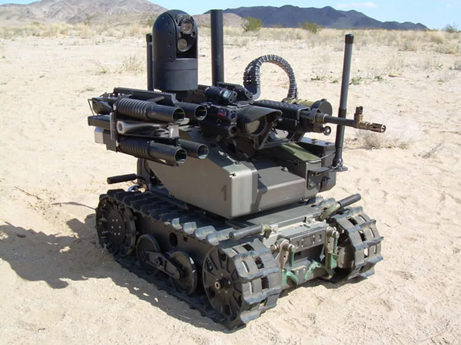 The Modular Advanced Armed Robotic System (MAARS), loaded with non-lethal laser dazzlers and audio deterrents, less-than-lethal grenades, menacing grenade launchers, and medium machine guns. Image Credit: QinetiQ / CNET